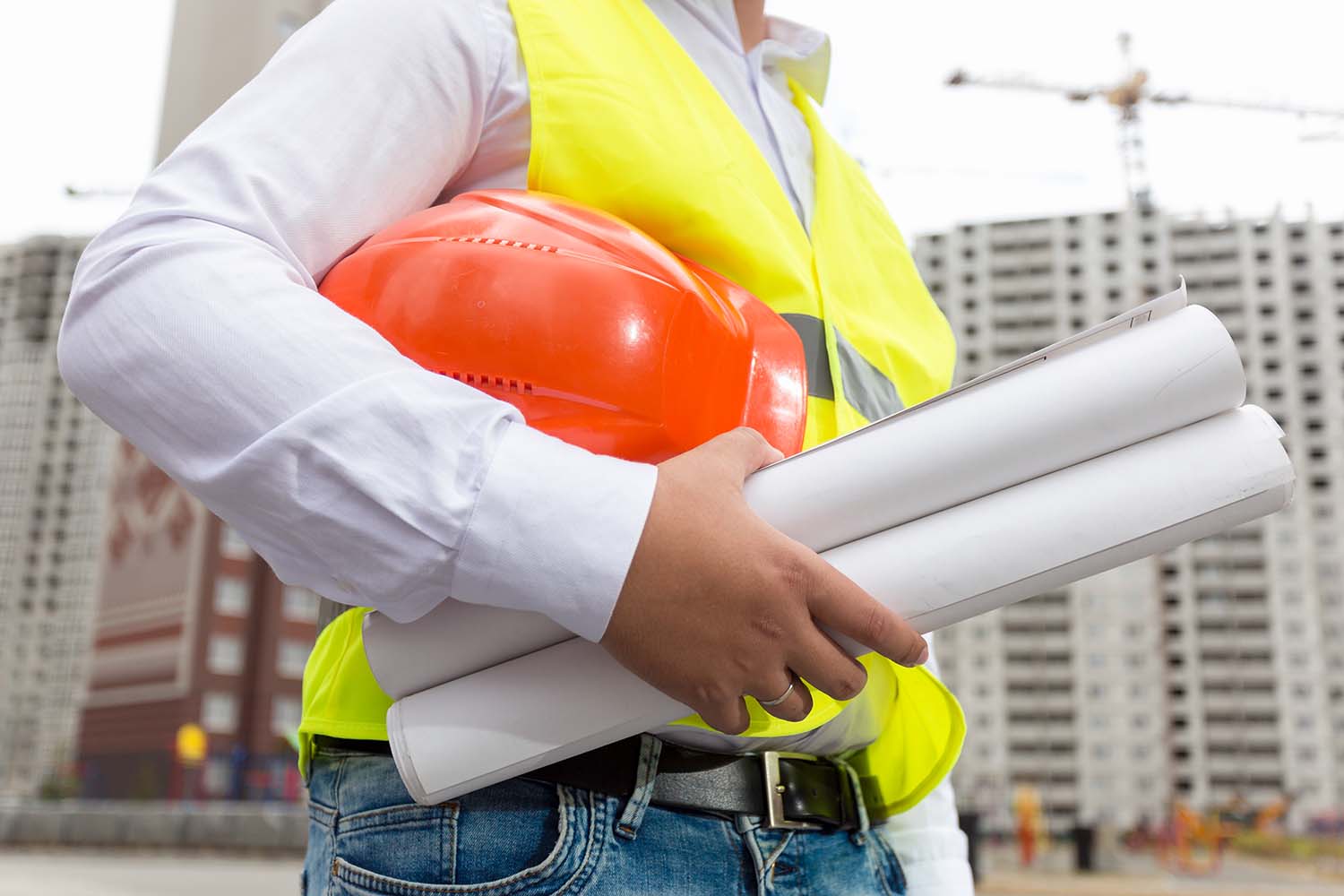 Cooling tower technician carrying inspection reports of the cooling tower blowdown and drift reports